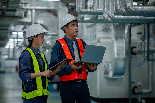 istock Engineers or technicians working extensive metal piping, HVAC systems, industrial equipment suggesting a controlled, well-maintained environment concept. 2231831767