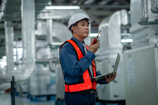 istock Engineers or technicians working extensive metal piping, HVAC systems, industrial equipment suggesting a controlled, well-maintained environment concept. 2231831819