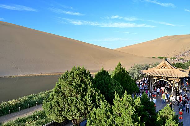 Sand buggy traveling on  the dune in Huacachina, Peru