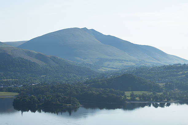 istock Tranquil Hillside and Reflections in a Misty Mountain Valley 2231834810