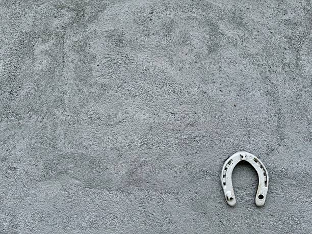 Rusty horse shoeagainst pure white background