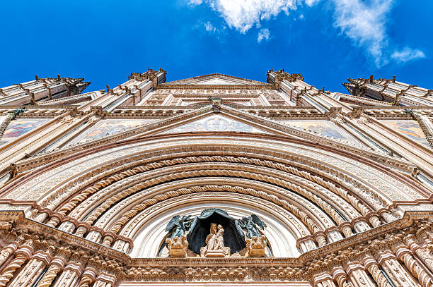 A detail of the sculptures above the gate of the duomo di Orvieto, Umbria, Italy