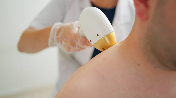 istock Man getting his back and shoulder hair removed 2231845381