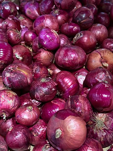 istock Fresh red onions piled at market 2231847007
