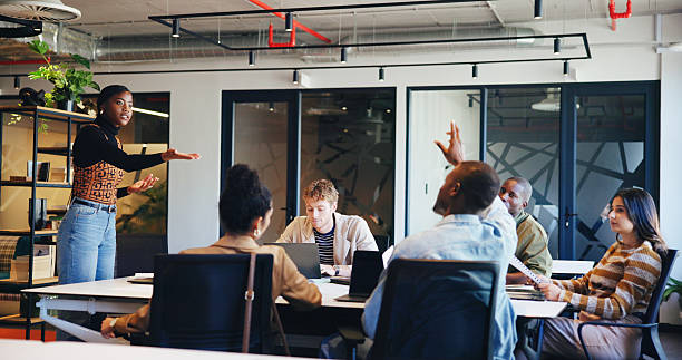 istock Presentation, speaker and question with business woman in office for workshop, teamwork and idea. Planning, collaboration and teaching with employees in agency for support, advice and brainstorming 2231848274