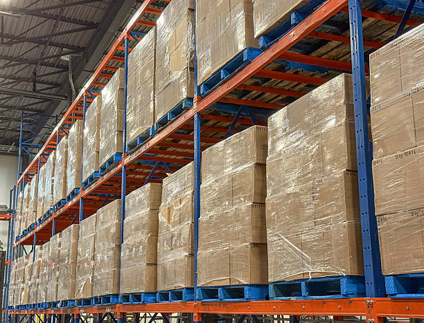 istock Pallets of boxes of wine stacked in distribution. 2231851614