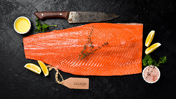 istock Fresh raw salmon or trout sea fish fillet. Top view. 2231852607