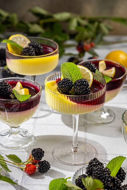 istock Lemon and blackberry panna cotta dessert garnished with fresh mint 2231852864