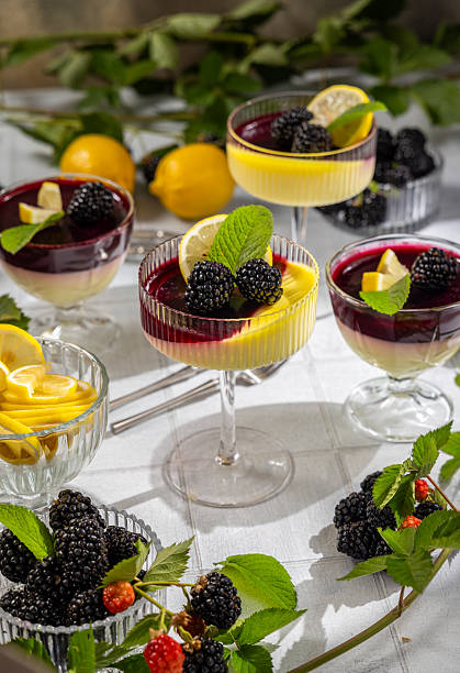 istock Lemon posset desserts with blackberry coulis and fresh mint 2231852916
