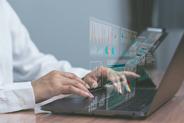istock Hands typing on laptop with digital charts overlay, representing data analytics, business intelligence, and modern technology workflow. 2231853735