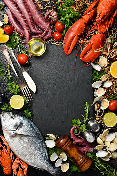 istock Set of fish, seafood and shellfish. Vertical photo. Top view. 2231855084