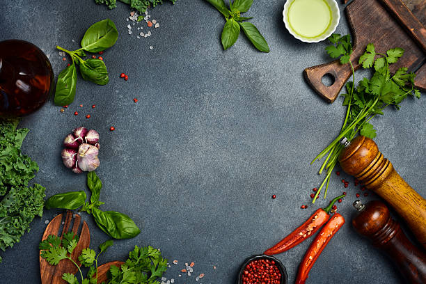 istock Stone black cooking background. Kitchen board with vegetables and spices. On a black stone background. Top view 2231855114