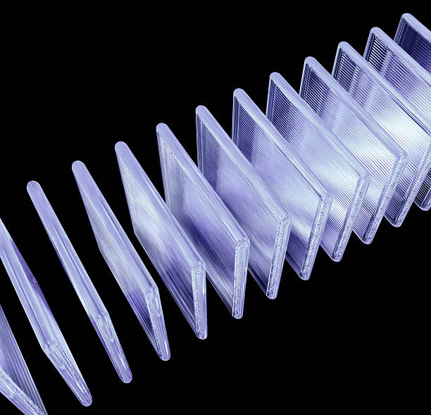 istock Captivating, translucent, 3D abstract object with a futuristic, holographic effect. This geometric shape is composed of many layered, transparent, prism-like elements that reflect and disperse light, creating a vivid, colorful spectrum 2231856590