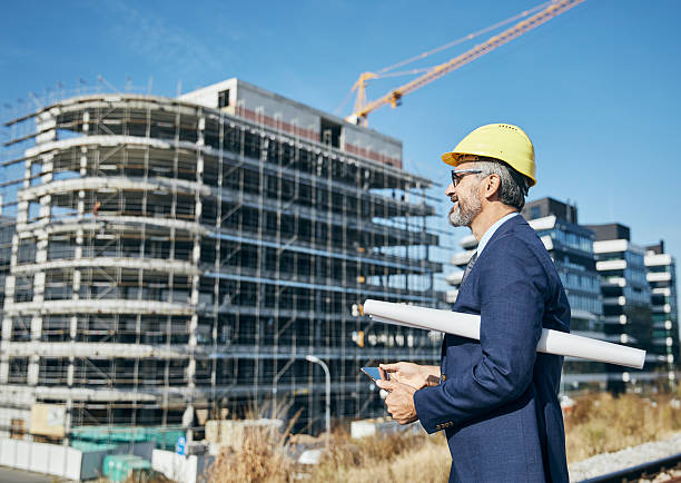 istock senior businessman architect helmet construction site building architecture tablet computer protective workwear blueprint plan 2231864030