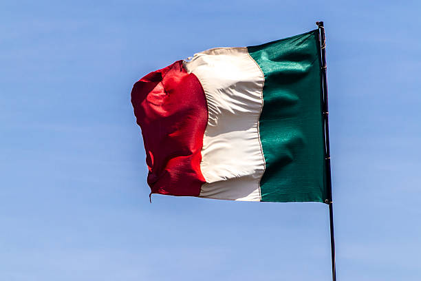 istock Italian flag waving against a clear blue sky 2231876164