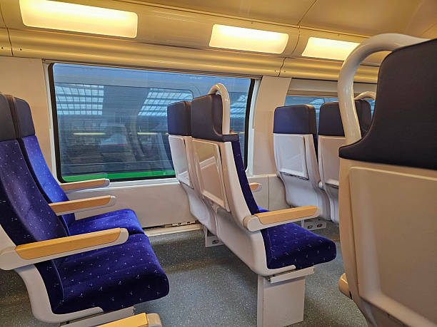 istock Modern Train interior with comfortable blue seats and large windows - Lille, France 2231876779