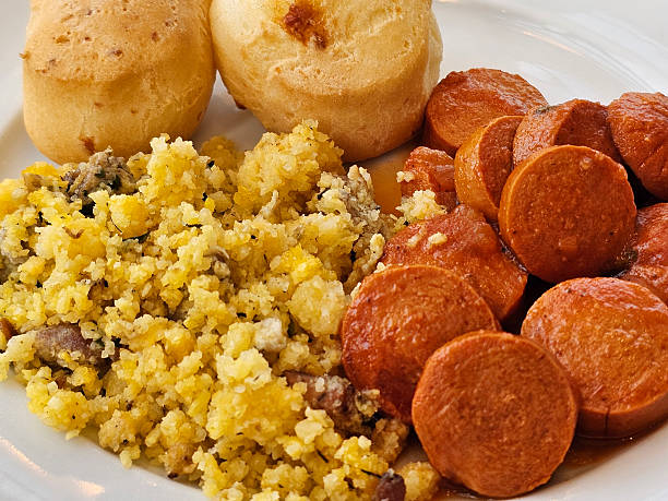 Two cheese breads (pao de queijo) on a plate