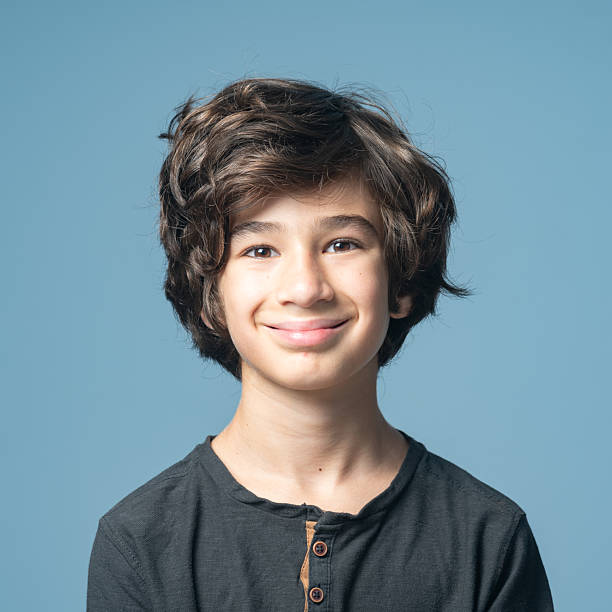 istock Studio portrait of elementary schoolboy on colored background 2231894335
