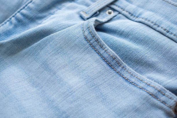 istock Old denim blue jeans fabric texture background close up 2231895899