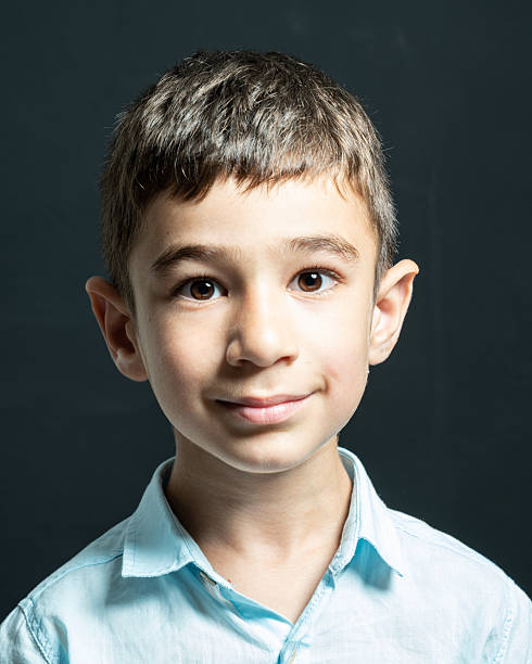 istock Studio portrait of elementary schoolboy on colored background 2231896102