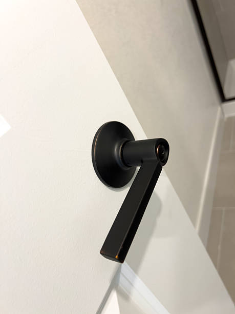 istock Matte Black Lever Handle on White Door 2231898852