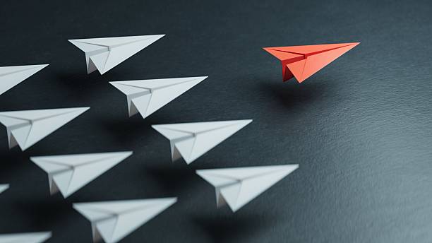 istock Different business concept.new ideas. paper art style. creative idea.Leaderplane concept, black leader plane leading white planes.3D rendering on black background. 2231900941