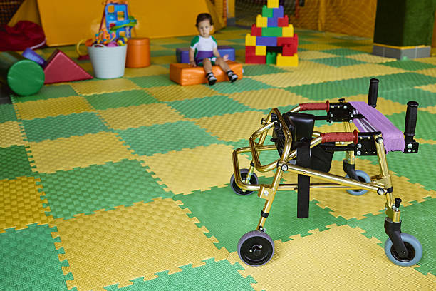istock Gold walker mobility device is positioned in a therapy space designed for children's physical rehabilitation activities 2231901505