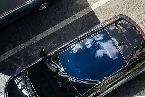 Sky and Clouds Reflected on Car Roof. beautiful reflecting the blue sky. Sustainability and Environmental Conservation. climate change, renewable energy, eco friendly living, social responsibility.