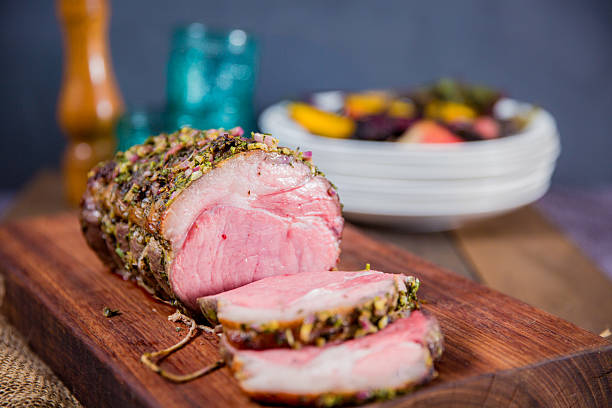 Delicious Herb-Crusted Beef Roast With Sliced Presentation on Wooden Board