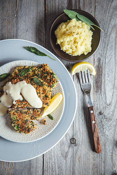 Crispy Breaded Beef Cutlet with Creamy Sauce and Mashed Potatoes