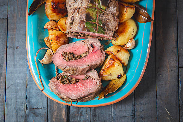 istock Roast Beef and Potatoes on Blue Plate with Rustic Presentation 2231906171