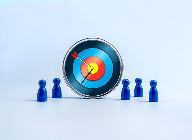 istock Big modern target board with an arrow hitting the center surrounded by blue team figures, symbolizing stakeholder alignment, shared goals, tech team focus, business objectives, and teamwork strategy. 2231909246