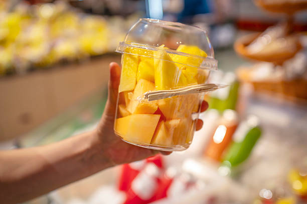 istock Clear plastic container filled with fresh cut pineapple and melon pieces 2231911783