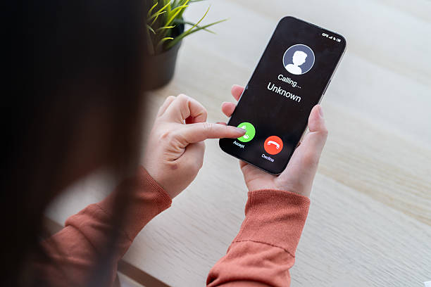 istock Phone scam alert with hacker and scammer calling unknown number, cybercrime, data theft, phishing attempt, fraud alert, digital security threat, cyber attack warning technology and crime concept 2231918008