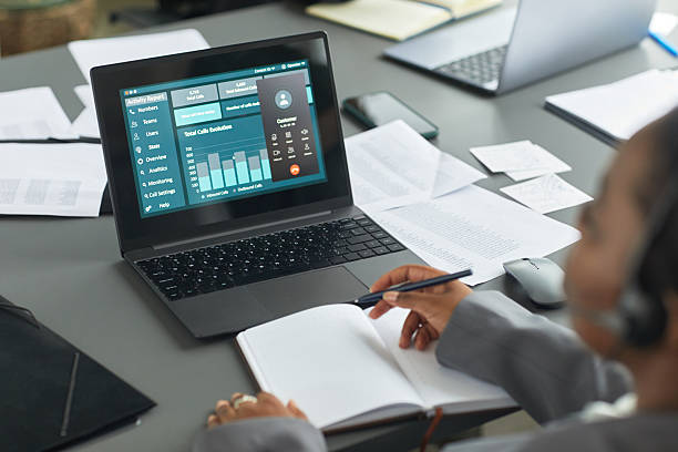 istock Black Woman Analyzing Business Data on Laptop during Meeting 2231918507