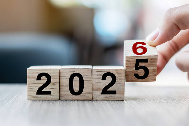 istock hand flipping block 2025 to 2026 text on table. Resolution, strategy, plan, goal, motivation, reboot, business and New Year holiday concepts 2231922494