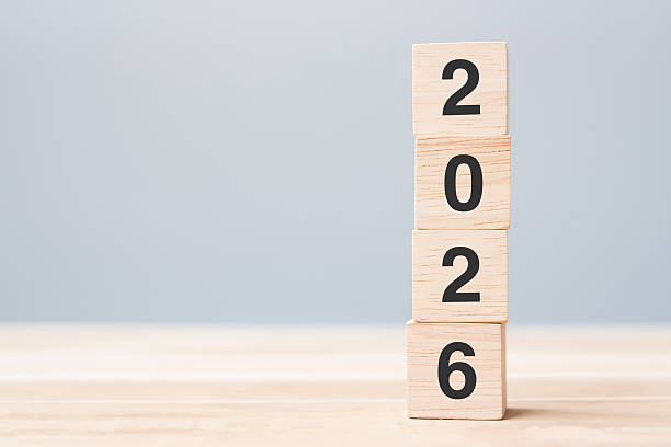 istock wooden cube block with 2026 text on table background. Resolution, plan, review, goal, start and New Year holiday concepts 2231922498