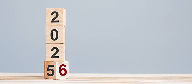 istock 2025 chang to 2026 wooden cube blocks on table background. Resolution, plan, review, goal, start, end year  and New Year holiday concepts 2231922505