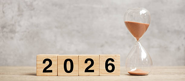 istock 2026  text with hourglass on table. Resolution, time, plan, goal, motivation, reboot, countdown  and New Year holiday concepts 2231922533