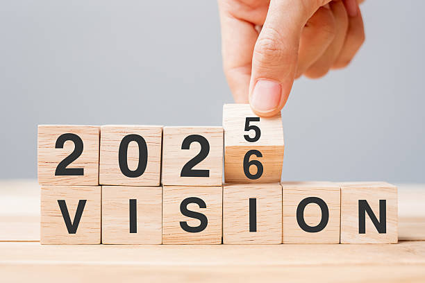 istock hand flipping block 2025 to 2026 VISION text on table. Resolution, strategy, goal, motivation, reboot, business and New Year holiday concepts 2231922826
