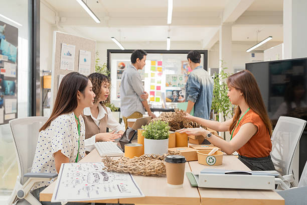 istock Creative ESG brainstorming session for earth friendly reuse recycle packaging campaign. Team develops viral environmental social impact strategy through sustainable innovation purpose driven marketing 2231926959