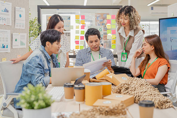 istock Creative ESG brainstorming session for earth friendly reuse recycle packaging campaign. Team develops viral environmental social impact strategy through sustainable innovation purpose driven marketing 2231927013