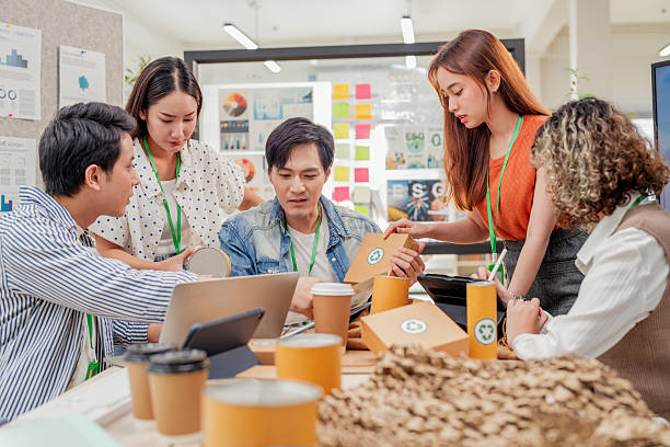 istock Creative ESG brainstorming session for earth friendly reuse recycle packaging campaign. Team develops viral environmental social impact strategy through sustainable innovation purpose driven marketing 2231927056
