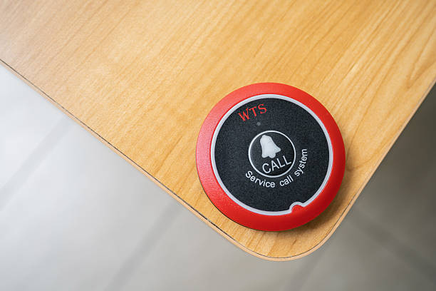 istock Service call system on wooden desk surface in restaurant 2231930356