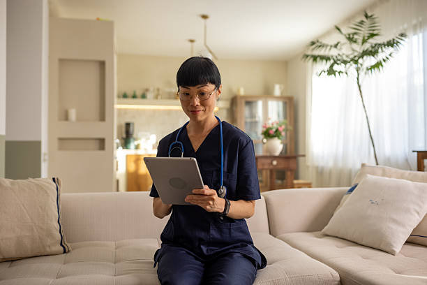 istock Female doctor at home with digital tablet 2231934390
