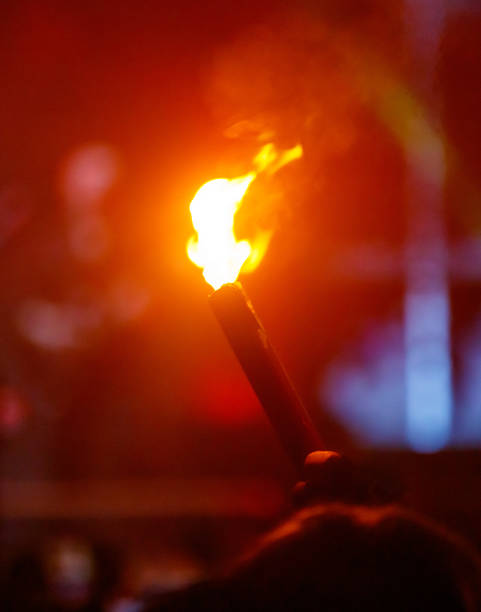 istock A person holding a lit torch 2231938059
