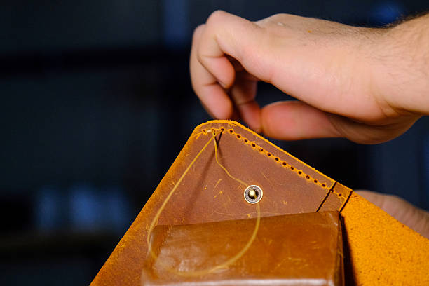 istock Close-up of Hand Stitching Leather with Needle and Thread 2231941274