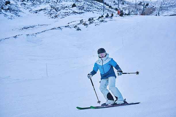 istock Confident skier descending groomed slope on winter mountain 2231942170