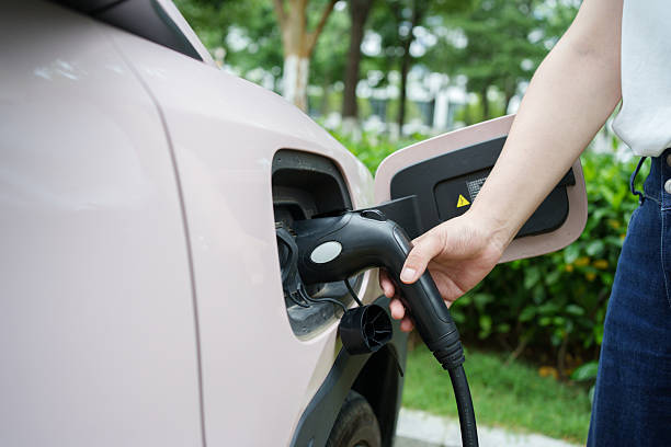 istock Hand holding an electric car charger 2231950574