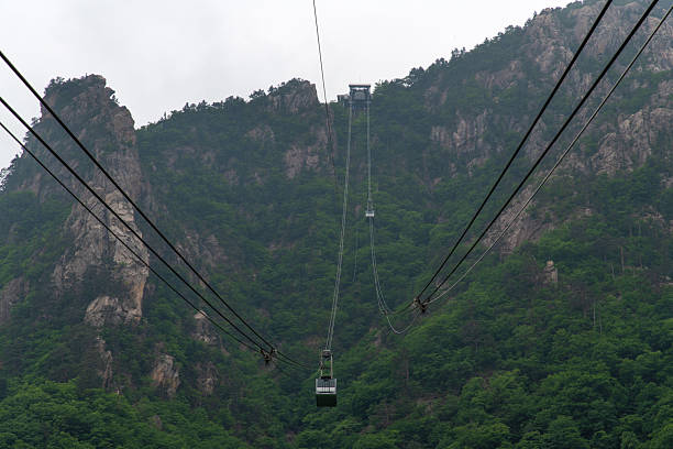 istock cable car hanging from the cable in the mountain 2231951156